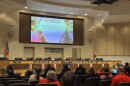 Orange County Public Schools board members met to discuss a contract impasse with two employee unions over proposed health insurance changes. The board voted to postpone the hearing until Nov. 13.