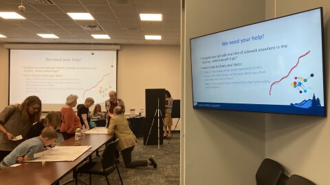 County staff speak with residents during a community meeting about the Pedestrian Plan Monday, March 9, 2026.