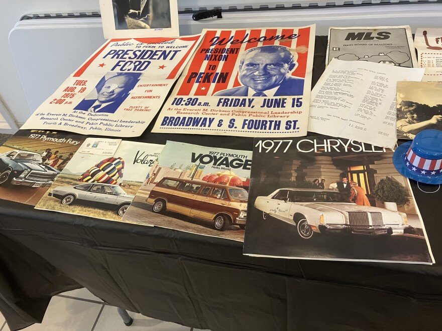 IN THE TIME CAPSULE: Posters welcoming President Richard Nixon and President Gerald Ford to Pekin, and 1977 vehicle brochures.