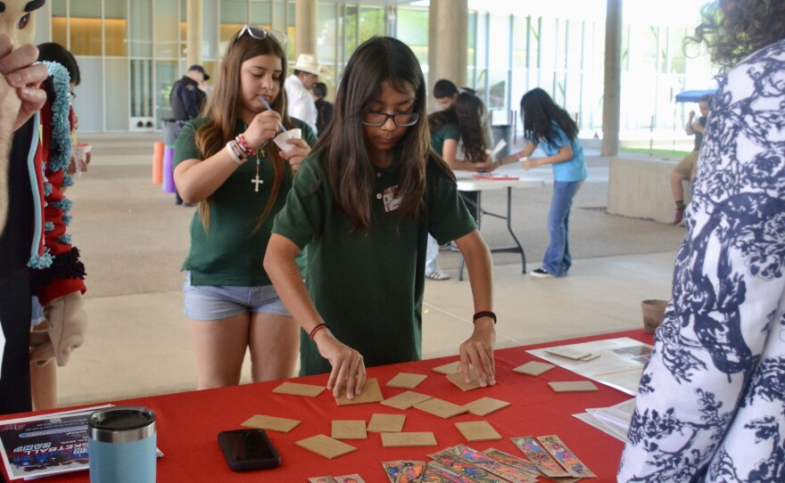 Students played a matching Spanish vocabulary game from the AWC Modern Language Department's table.