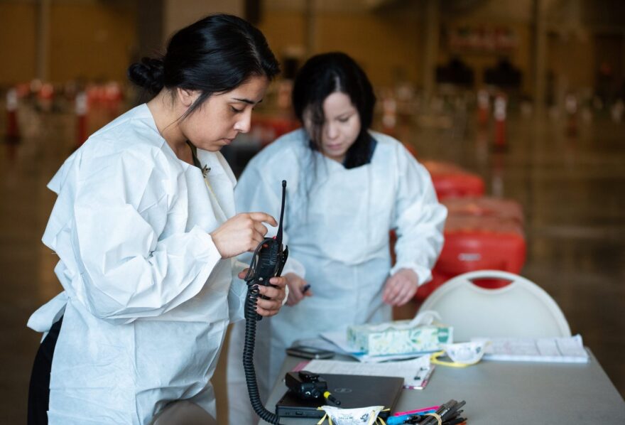 Staff prepare for the first patients of the day for drive-through testing for the coronavirus at the Bennett Event Center at State Fair Park in Oklahoma City on April 2.