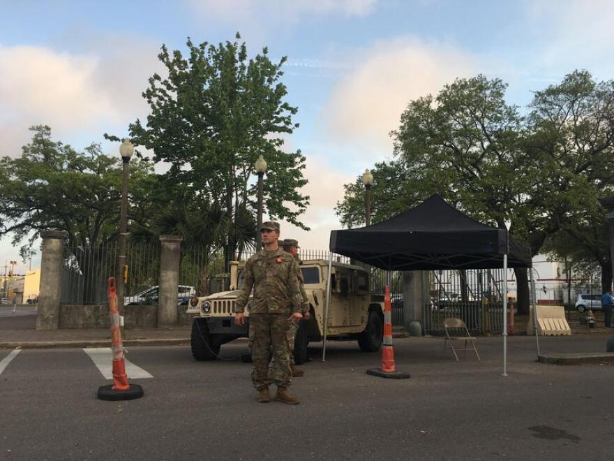 National guard troops stand outside the entrance to Mahalia Jackson theater on the first day of the drive through testing program. That site will be closed. The only site left with be at the UNO Lakefront Arena. 