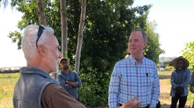 U.S. Senator Adam Schiff of California talks with farmer Phil McGrath during a visit to McGrath's Camarillo farm Thursday.