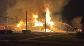 Flames shoot from a building in the 600 block of Triplett St. in Owensboro, KY, Sunday, Nov. 30, 2025