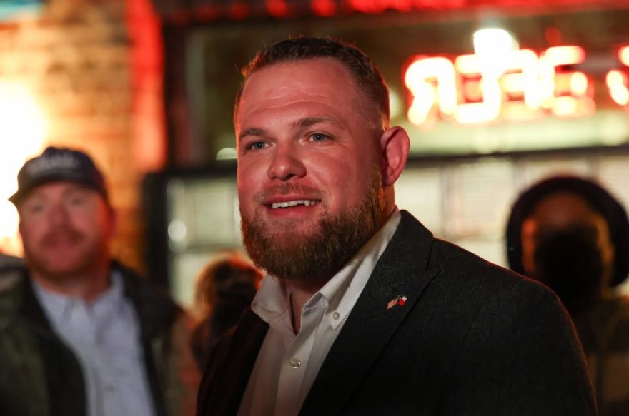 Democrat Taylor Rehmet talks to attendees at his election night watch party Jan. 31, 2026, in Fort Worth.