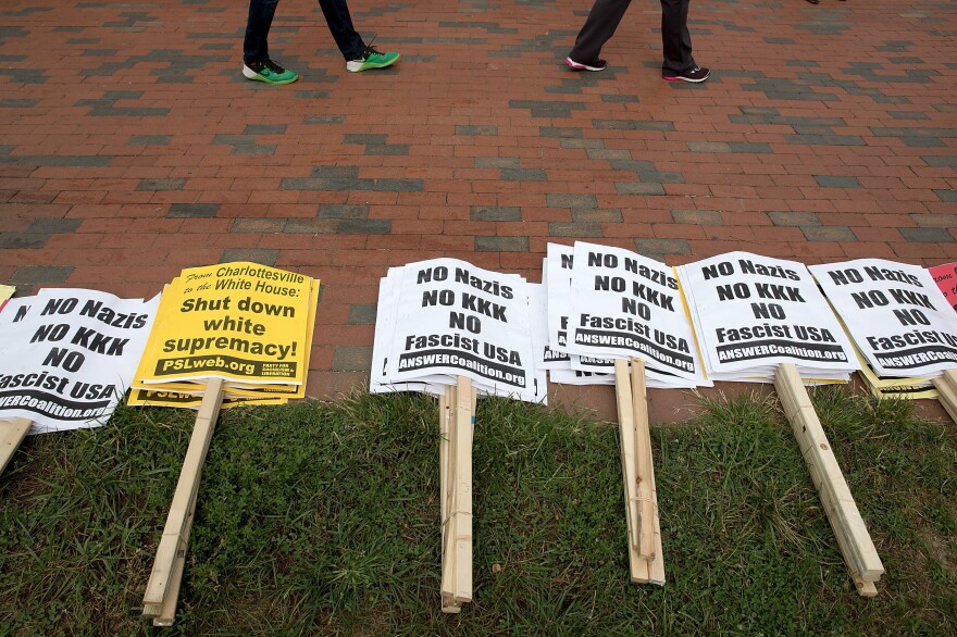 Anti-KKK signs laid out by counterprotesters in Lafayette Square on Sunday ahead of a planned white supremacist "Unite the Right" rally across from the White House.