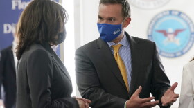Vice President Kamala Harris talks with Jacksonville Mayor Lenny Curry, as she visits the Jacksonville Community Vaccination Center, in Jacksonville, Fla., Monday, March 22, 2021. (AP Photo/Jacquelyn Martin)