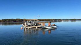 Aidan and Kit Gallagher check equipment at Little Bay Beauties oyster farm, owned by Kit Gallagher, on Monday, Oct. 19, 2026.