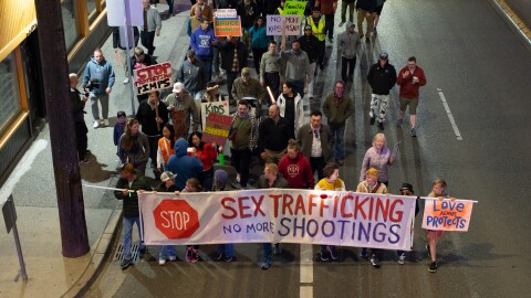 A crowd marches down Aurora Avenue North on Saturday.