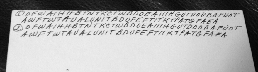 This undated family photo shows the back of an index card on which Dorothy Holm wrote before her death in 1996. The letters, it appears, were reminders to herself of the Lord's Prayer. She put codes on about 20 other cards.