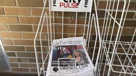 City Pulse newsstand with stacked copies