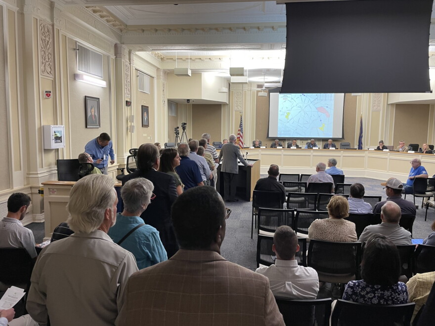 People initially lined up to speak to members of the Urban Growth Management Advisory Committee. Fire code regulations then prompted the chair to call speakers one by one to the podium