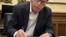 Indiana Gov. Mike Braun signs legislation into law from his Statehouse office on Tuesday, May 6, 2025.