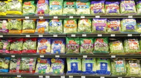 Packaged salads sit on the shelves of a Bell Market grocery store in San Francisco in 2003. Hundreds of recent salad products from Dole and Fresh Express have been recalled because of listeria concerns.