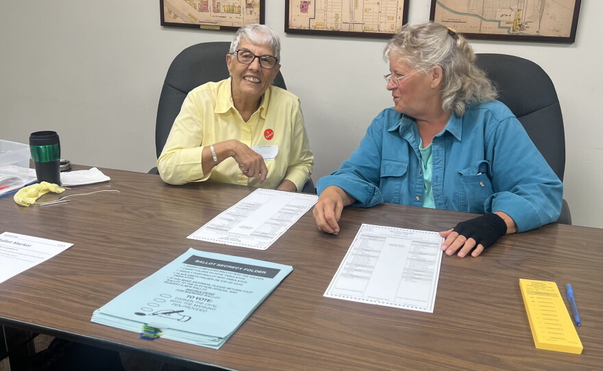 Election judges Gwenn Smith, left, and Kelly Barrett are ready to hand out ballots to voters on Primary Election Day, Aug. 11, 2026, at Deer River City Hall.