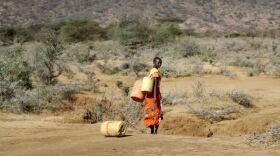 FILE - A Samburu woman fetches water during a drought in Loolkuniyani Primary School, Samburu County, Kenya, Oct. 16, 2022. Looking back at 2022’s weather with months of analysis, the World Meteorological Organization says last year really was as bad as it seemed.