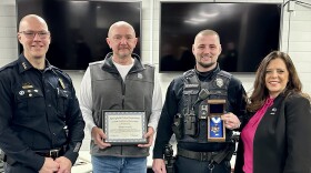 From left: Chief Ken Scarlette, Nathan Gutmann, Officer William Meacham, Mayor Misty Buscher.