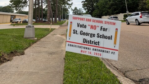 A sign outside the East Baton Rouge Parish School System office opposes Amendment 2, which would create a separate school district for the new city of St. George, on May 11, 2026.