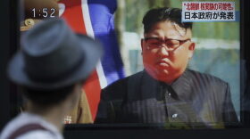 A man watches a TV news program on a public screen showing an image of North Korean leader Kim Jong Un while reporting North Korea's possible nuclear test in Tokyo Sunday, Sept. 3, 2017. (Eugene Hoshiko/AP)