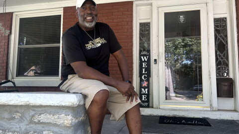 Anthony Wilson sits on his front porch on a Monday afternoon in late August after finishing his work shift.