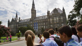 In this July 10, 2013, file photo, prospective students tour Georgetown University's campus in Washington. (Jacquelyn Martin/AP)