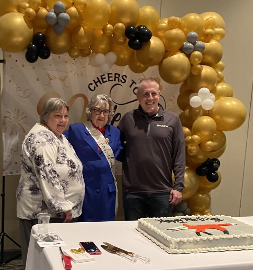 Brenda Groff and Dennis Voigt pose with Minnie for her birthday.