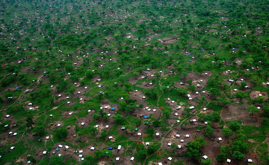 White tents scatter across the Yida refugee camp along northern border of South Sudan on June 29. The international aid community is struggling to provide food and medical supplies to the families after heavy rains blocked roads to the camp.