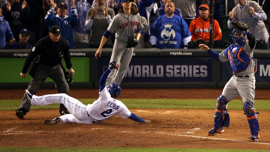 Alcides Escobar of the Royals scores a run on a two-run RBI single hit by Eric Hosmer in the fifth inning of Game Two of the World Series.