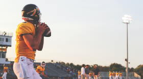 A football player with Kickapoo High School in Springfield, MO readies a throw.