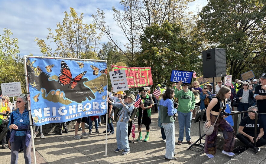 People with signs at a rally. 