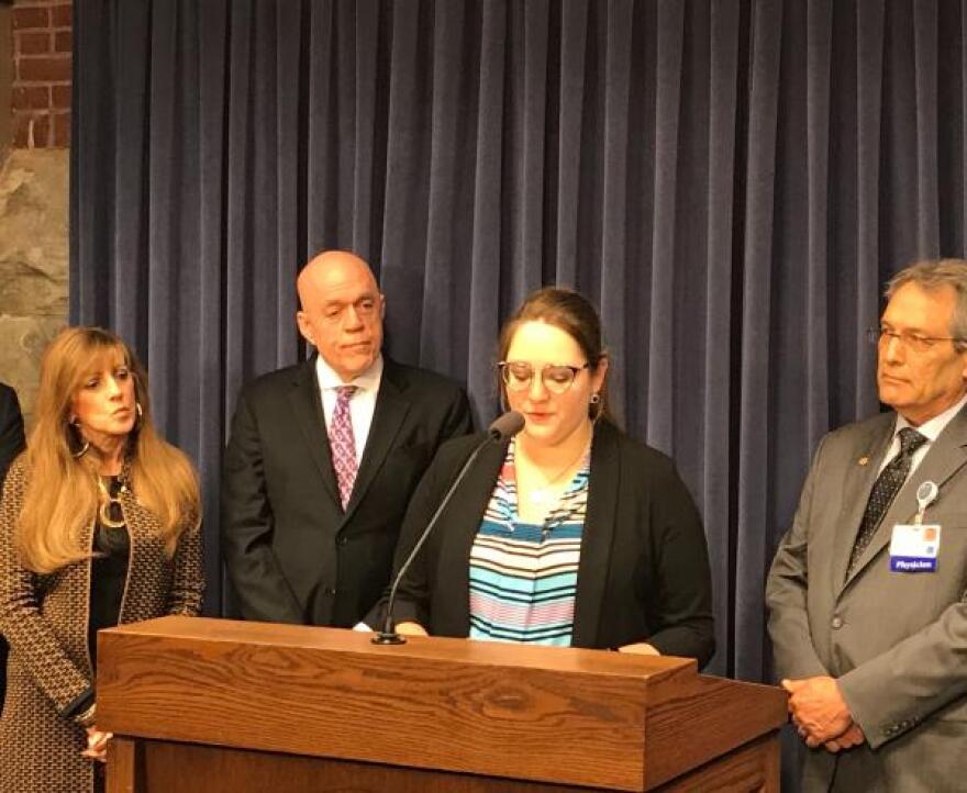 Isabella McKenna (center) speaks at a press conference alongside (from left to right) Sen. Linda Homes, Rep. Greg Harris and Illinois State Medical Society President Paul Pedersen.