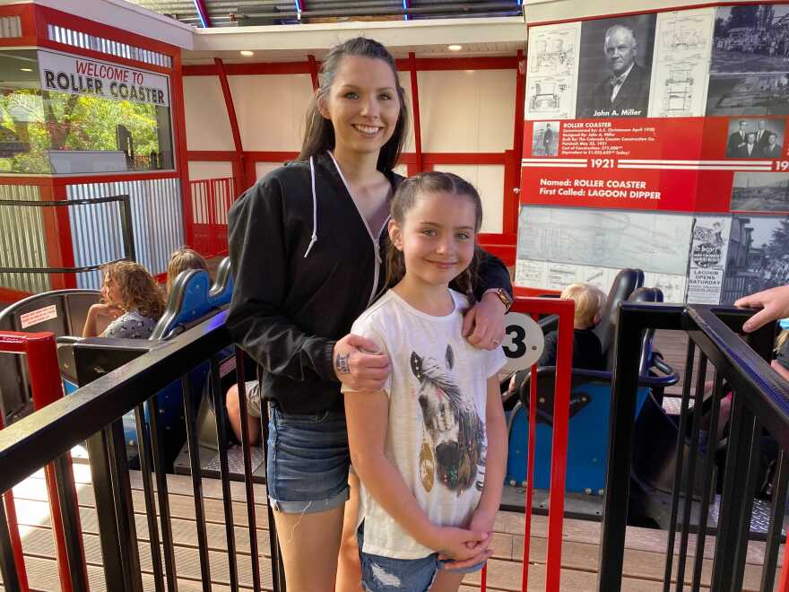 Emma Bassett waits in line for the Roller Coaster with her mom, Mackenzie Bassett.