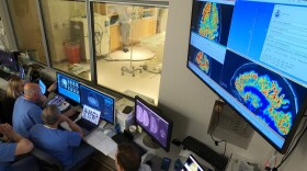 The West Virginia University Rockefeller Neuroscience Institute team, shown in the MRI suite’s control area, plans an ultrasound blood-brain barrier treatment. Scientists have found a way to help Alzheimer’s drugs seep inside the brain faster by temporarily breaching its protective shield.