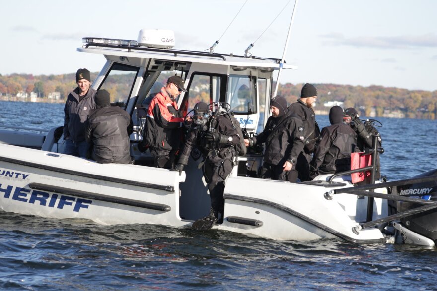 A recovery team made of divers from the Wisconsin Historical Society and the Dane County sheriff's department prepare to dive on Lake Mendota.