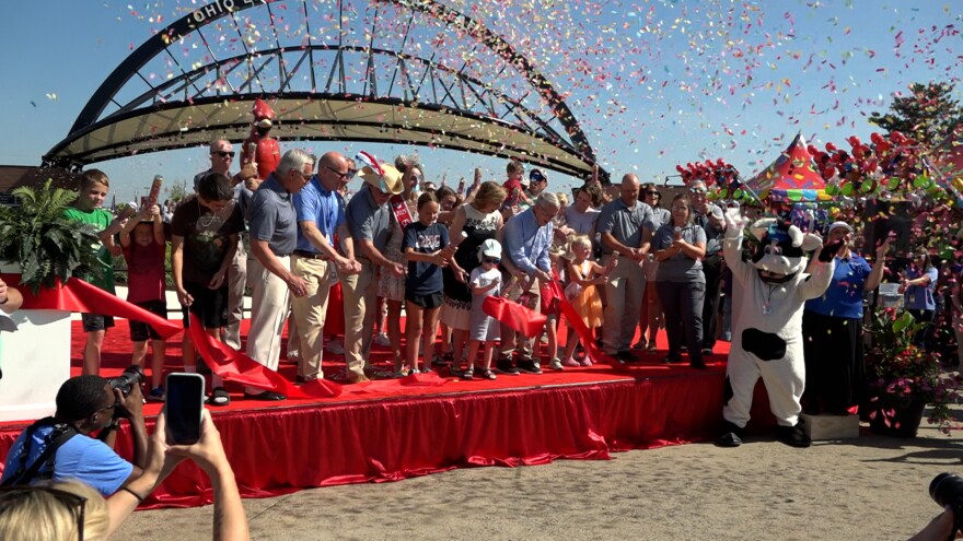 State officials including Gov. Mike DeWine cut the ribbon to open the 170th Ohio State Fair on July 23, 2025.