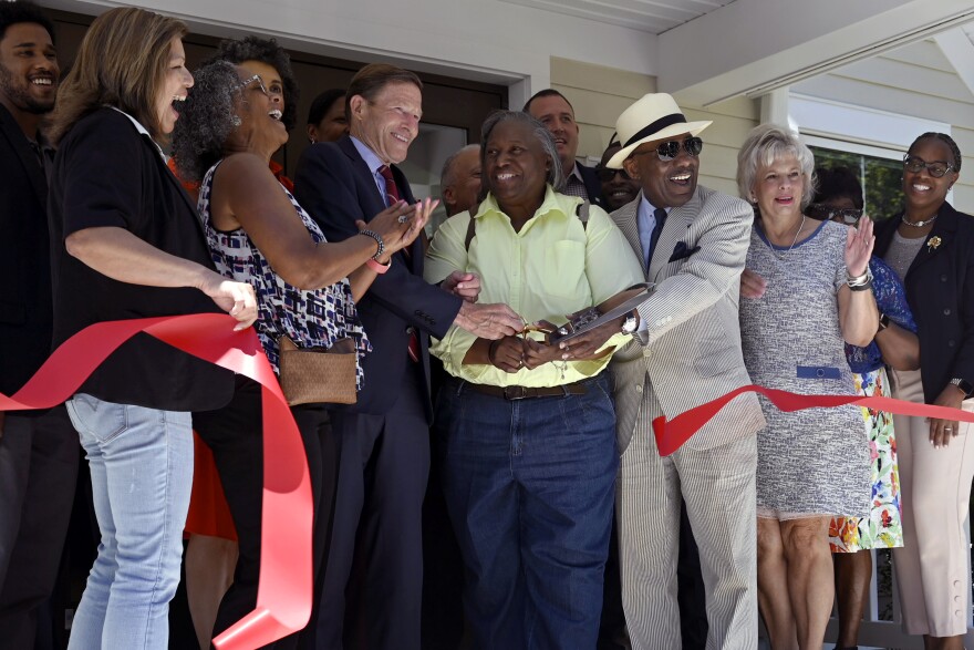 Officials hold a ribbon cutting ceremony unveiling a new affordable housing project at the Valley Townhomes on Valley Street June 28, 2024 in New Haven, Connecticut. (Front row left to right) CT Department of Housing Commissioner Seila Mosquera-Bruno, State Representative Toni Walker U.S. Senator Richard Blumenthal (D-CT) New Haven Alder Honda Smith, William Kilpatrick, Chairman of the Board, Housing Authority of New Haven and Suzanne Piacentini, Department of Housing and Urban Development (HUD).