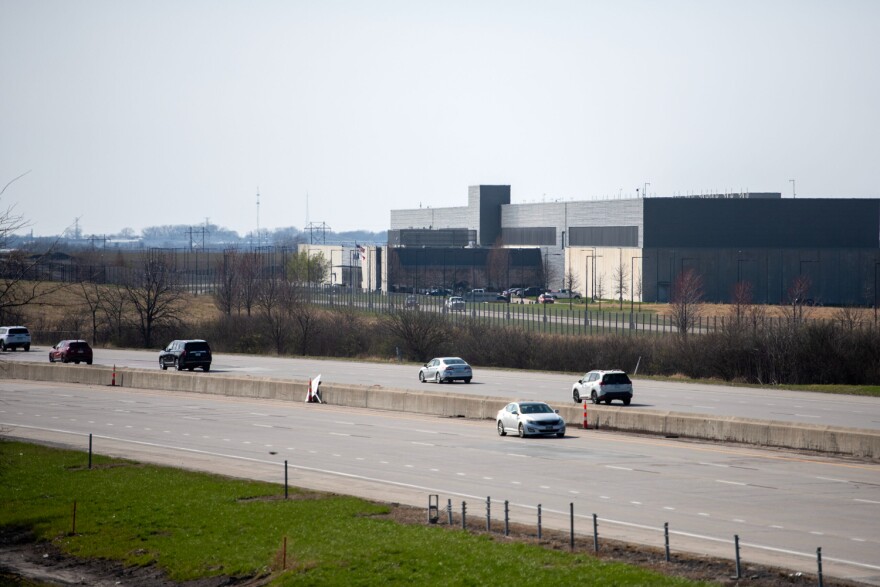 Cars pass by a Meta data center Tuesday, April 8, 2025, in Altoona, Iowa.