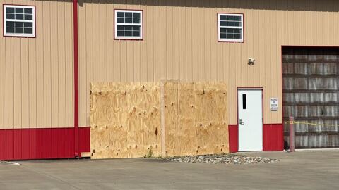 Plywood covers damage on the east side of the YNOT building in Chatham.