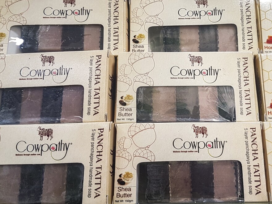 Boxes of soap from Cowpathy Care. Cow dung is dried and turned into a powder, then added to the bars.