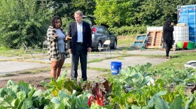 Soul Food Project Executive Director Danielle Guerin shows Indianapolis mayor Joe Hogsett some of the crops being grown at the farm on Sheldon Street. The site is one of three in the city.