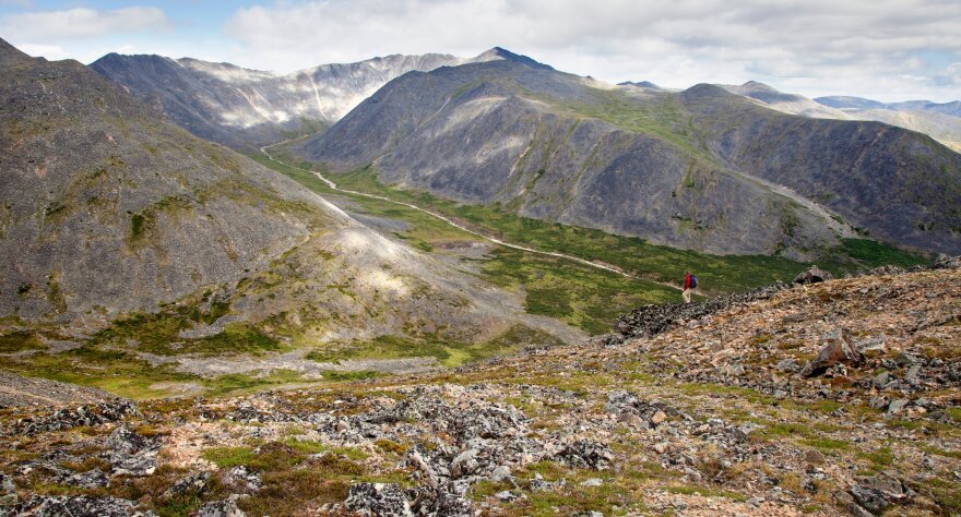 a person hiking in the mountains
