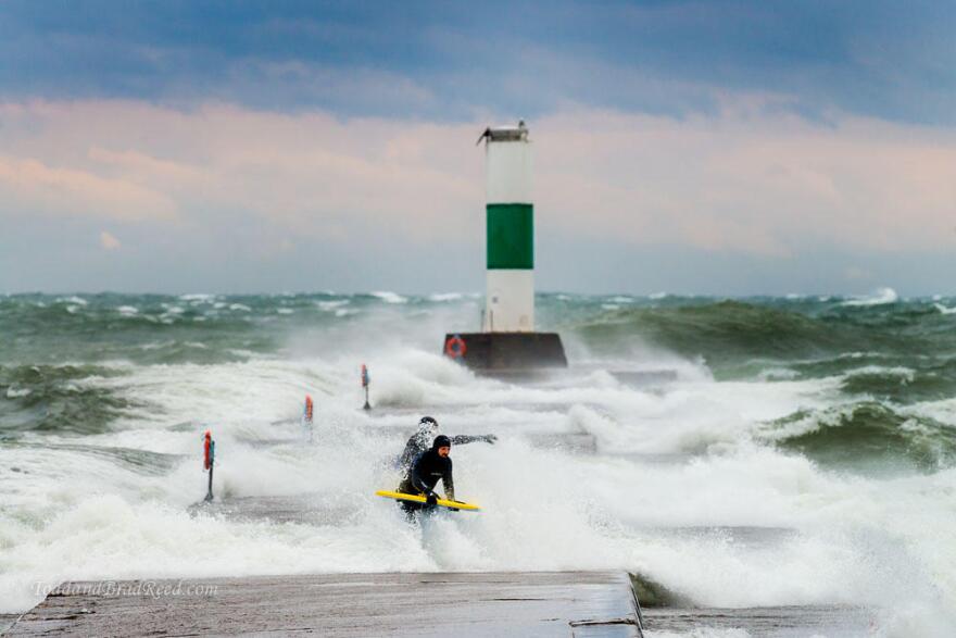 A few surfers brave the 40-plus mile per hour winds to try to catch some Lake Michigan surf during a November storm in 2015.