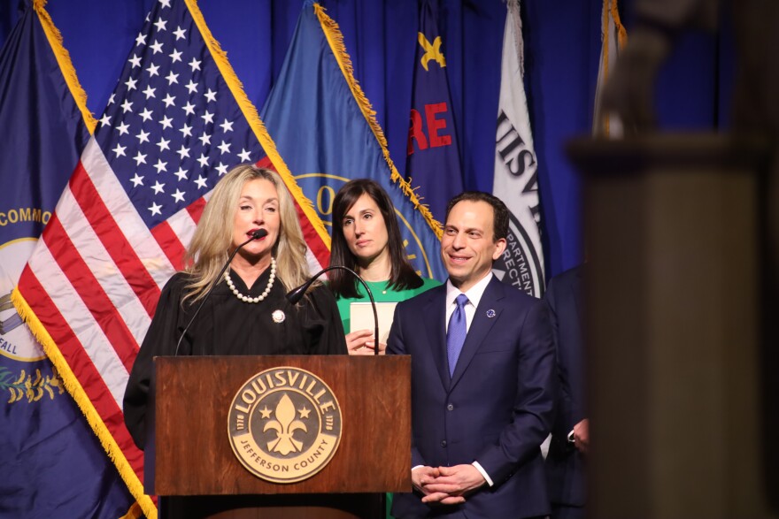 Craig Greenberg stands behind a podium at his inauguration