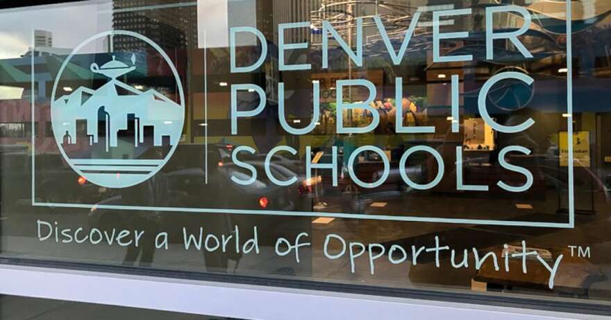 A glass window that has the Denver Public Schools logo.