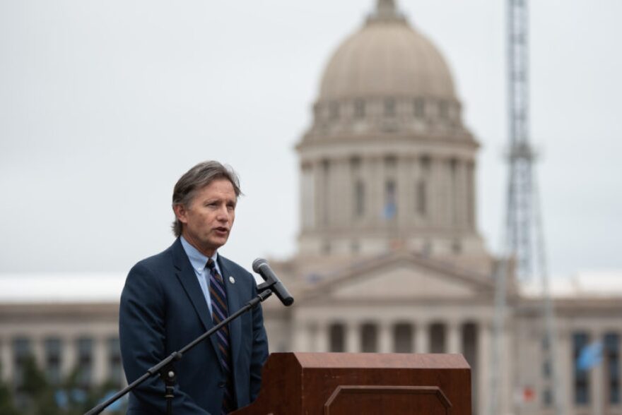 Oklahoma Attorney General Mike Hunter speaks on the State Capitol’s south lawn during the YWCA’s wreath ceremony kicking off Domestic Violence Awareness Month.