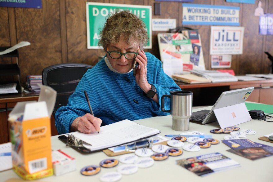 Mary Lynne Donohue, co-chair of the Sheboygan County Democratic Party, speaks with Sheboygan City Clerk Meredith DeBruin on Nov. 8, 2022 at Democratic Party headquarters in Sheboygan, Wis. Earlier in the day, Donohue had urged DeBruin to have a local church serving as a polling site remove a message that urged voters to “save your religious freedom.” The message was later removed.