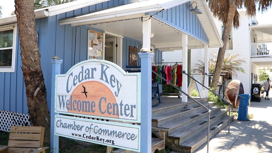 A “Welcome to Cedar Key” sign stands outside the Chamber of Commerce building in Cedar Key, Fla. The sign greets visitors as the island continues its ongoing recovery efforts.