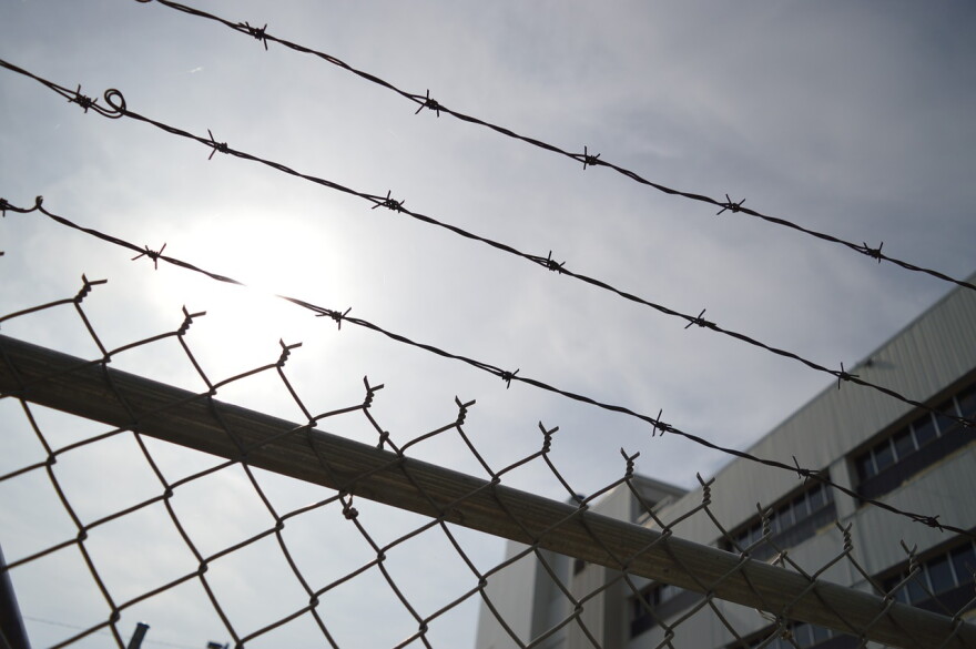 Barbed wire above a chain link fence