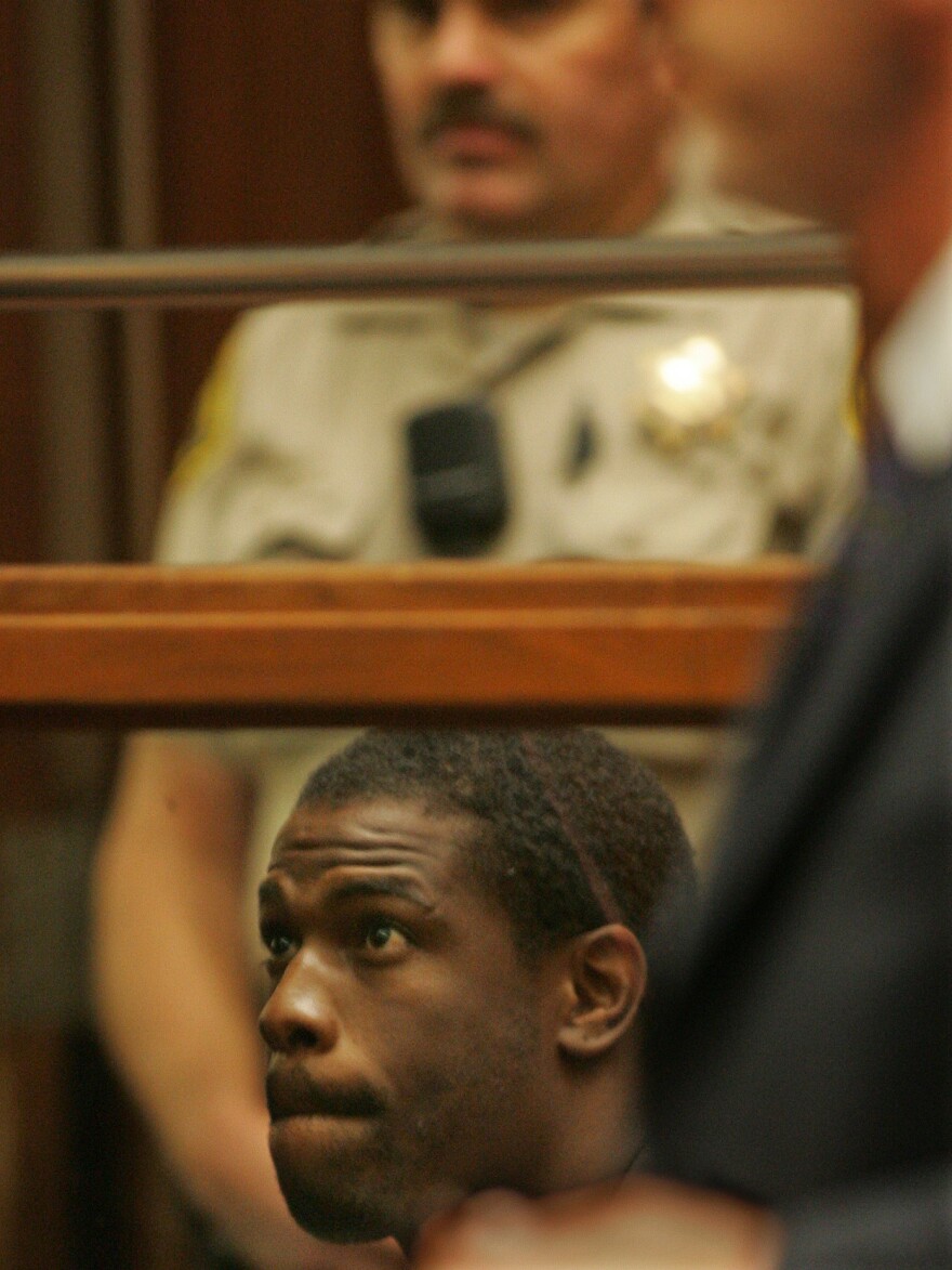 Lawrence Phillips, seen here in a 2005 photo, has been charged with murder while serving a prison sentence for assault and other charges.