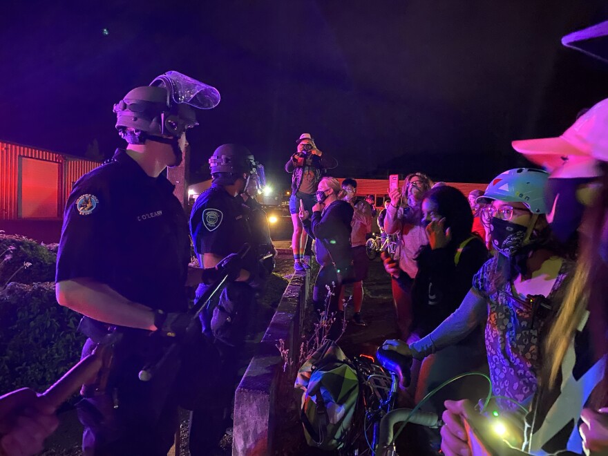 SPD officers stand at a blockade across from protesters in June 2020. Actions taken by law enforcement against Black Unity and Black Lives Matter activists in Springfield and Thurston resulted in complaints of police brutality and a lawsuit by the Civil Liberties Defense Center.